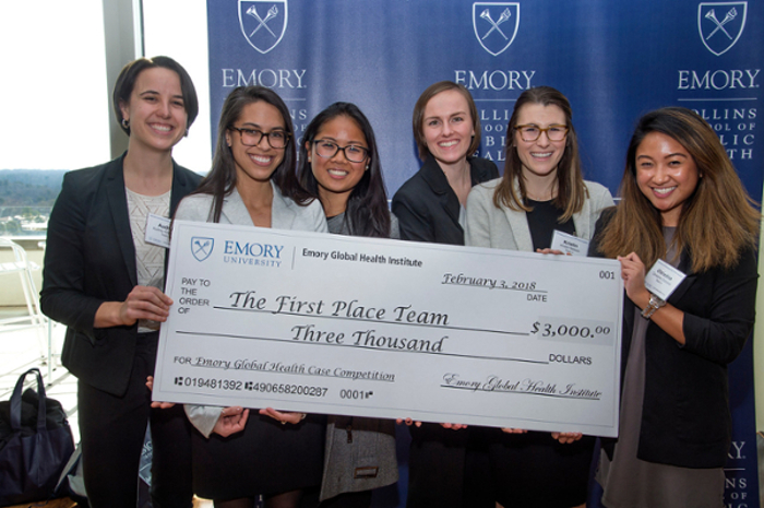 team holding a giant check for $3,000 for first place