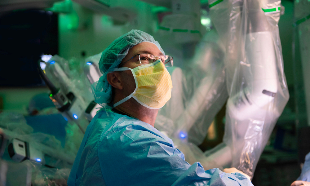 Doctor in the operating room using medical machinery